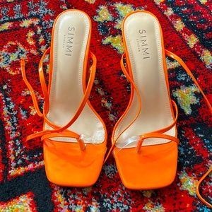 Strappy orange heel!